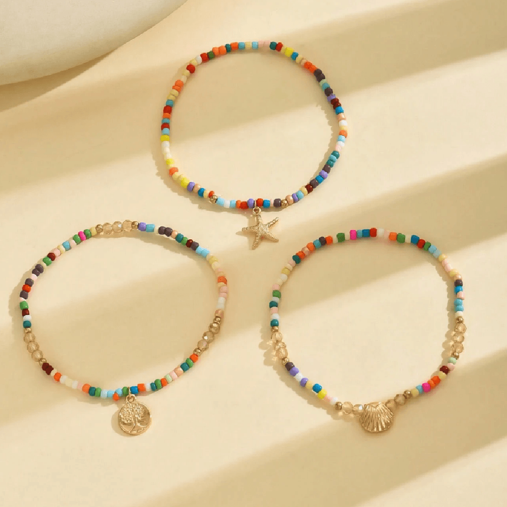 Anchors bracelet on a foot against a sandy background
