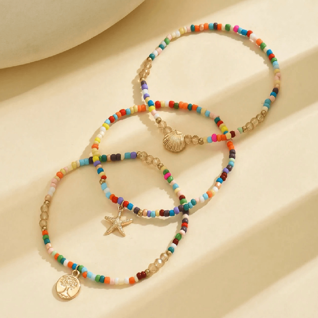 Anchors bracelet on a foot against a sandy background
