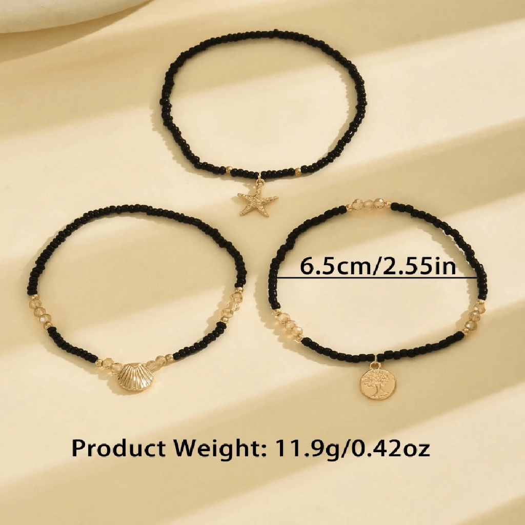 Ankle bracelet with star and shell charms on a sandy background