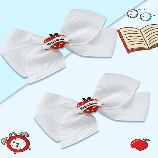 White hair bows with red apple and 'Go to school' text on a light blue background