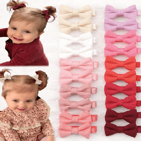 Two children with hair bows and a set of colorful bow hair accessories.