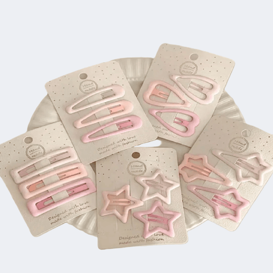 Set of pink hair clips on their packaging with a white background