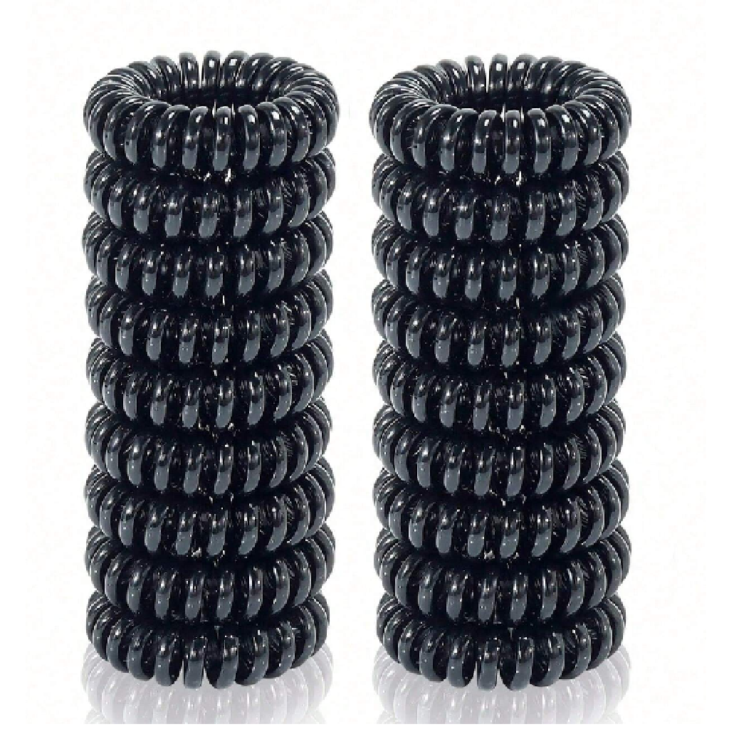 Two black coiled hair ties on a white background