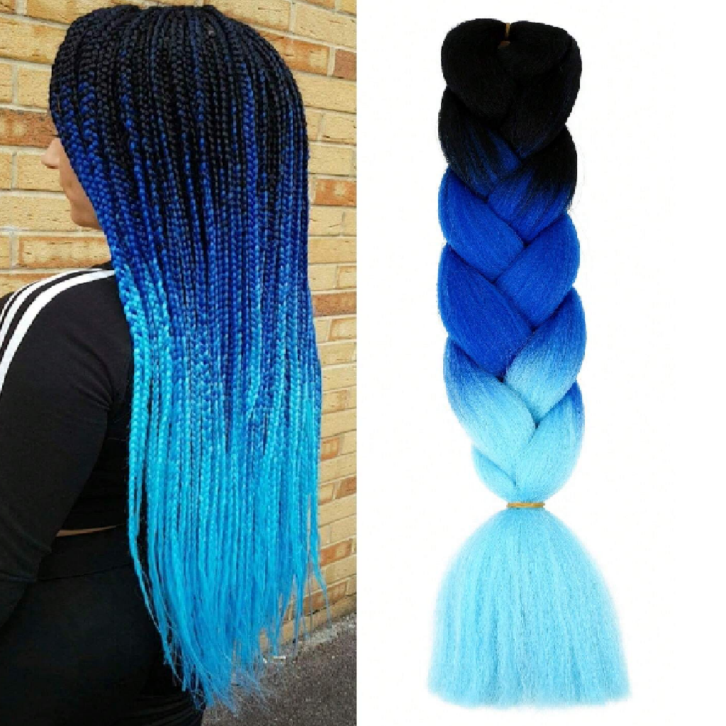 Blue and black braided hair extensions with a person wearing a black outfit against a brick wall.