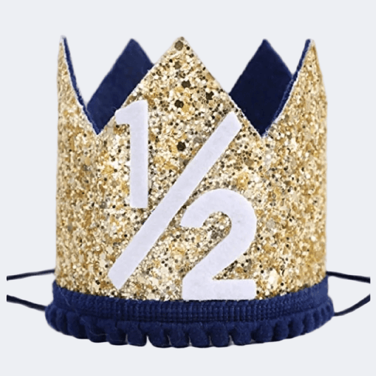 Gold glittery party hat with '1/2' on a white background