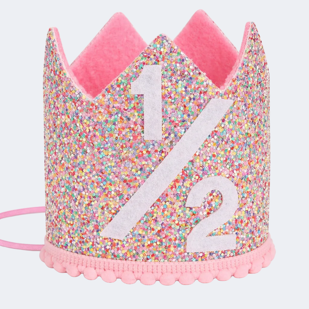 Glittery birthday crown with number 1/2 on a white background