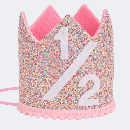 Glittery birthday crown with number 1/2 on a white background