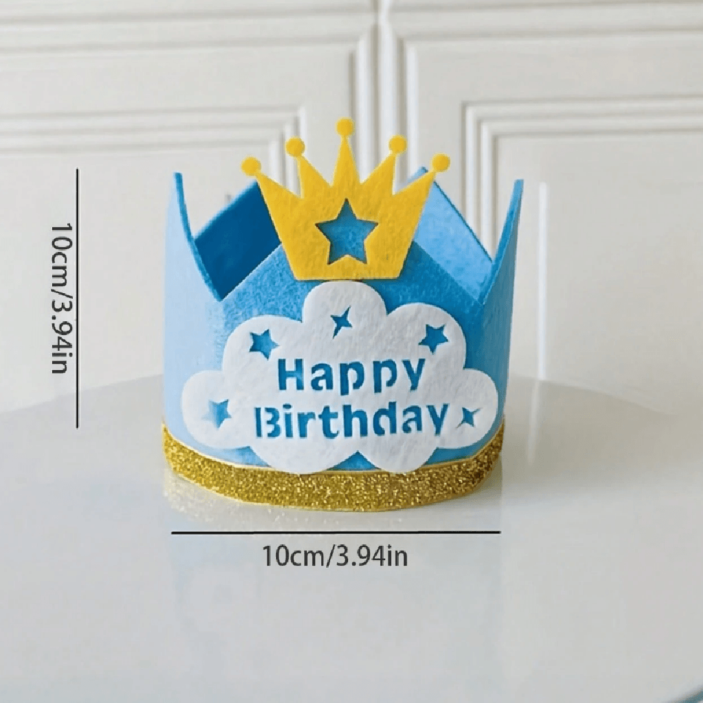 Blue birthday crown with yellow glitter band and crown on a white surface