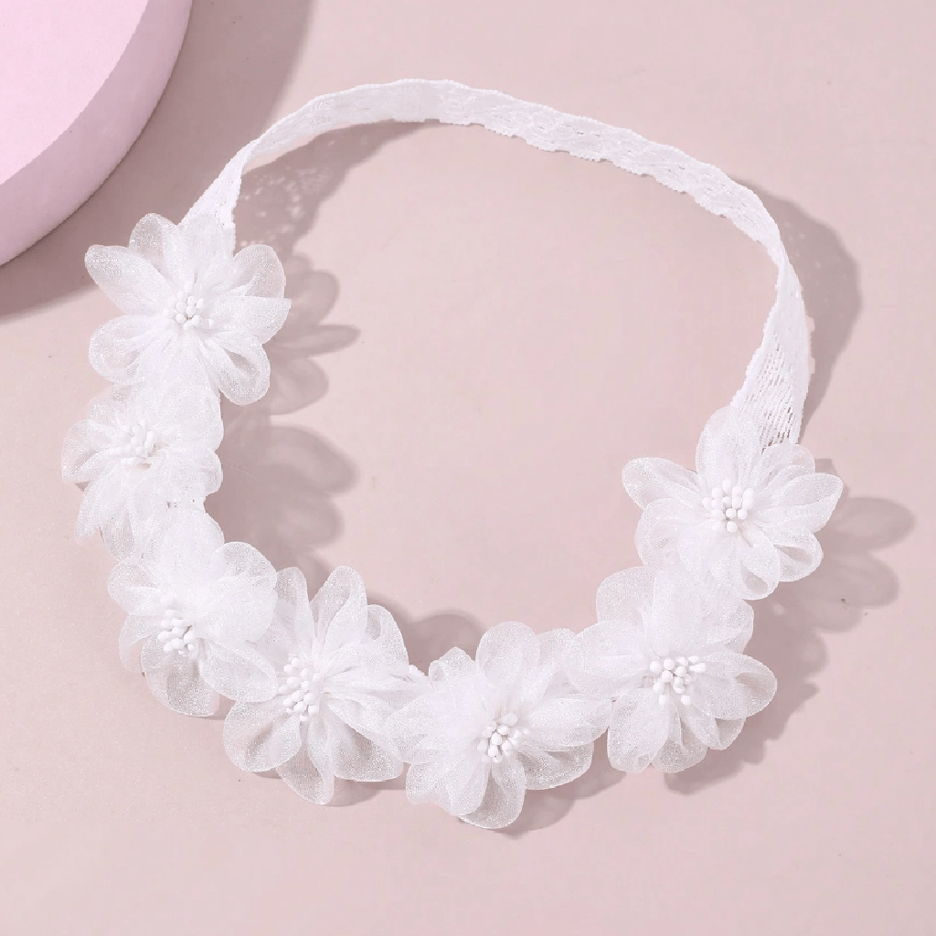 White floral headband on a white background