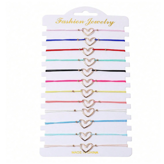 Set of heart-shaped gold bracelets on a white card 