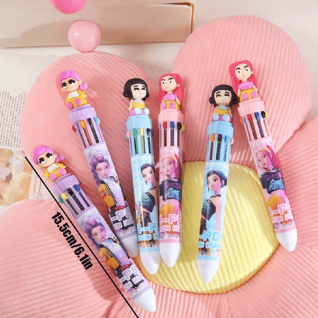 Set of colorful pens with character designs on a pink textured surface