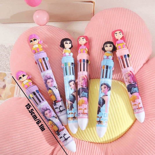 Set of colorful pens with character designs on a pink textured surface