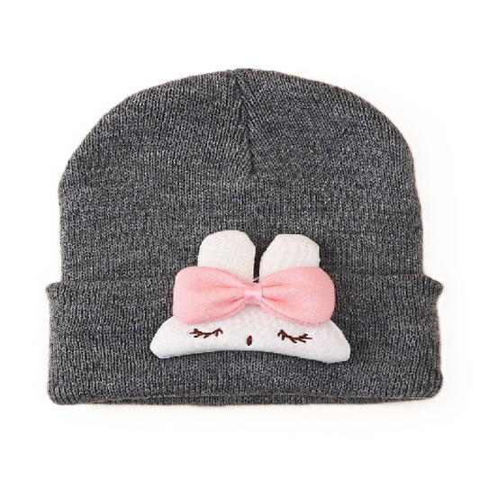 Gray knit beanie with a cartoon cloud design featuring a pink bow on a white background