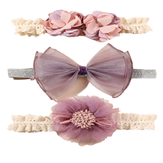 Set of three decorative headbands with flowers and bows