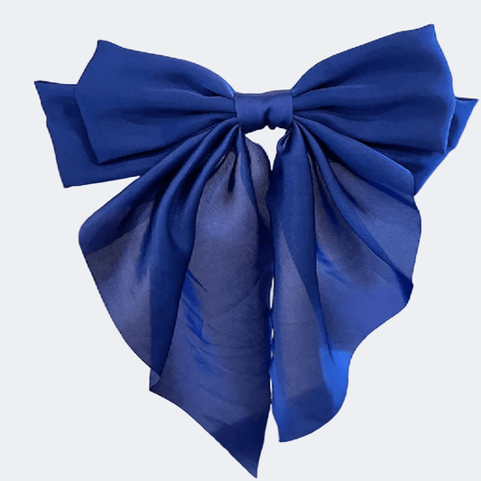 Blue bow on a light gray background