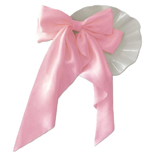 Pink bow on a white background