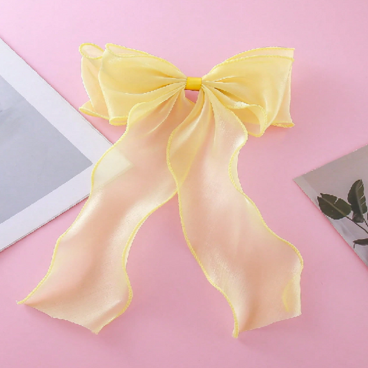 Yellow bow on a pink background