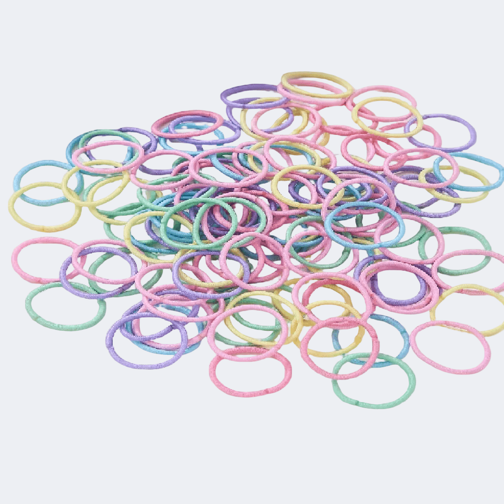 Pastel-colored rubber bands on a white background