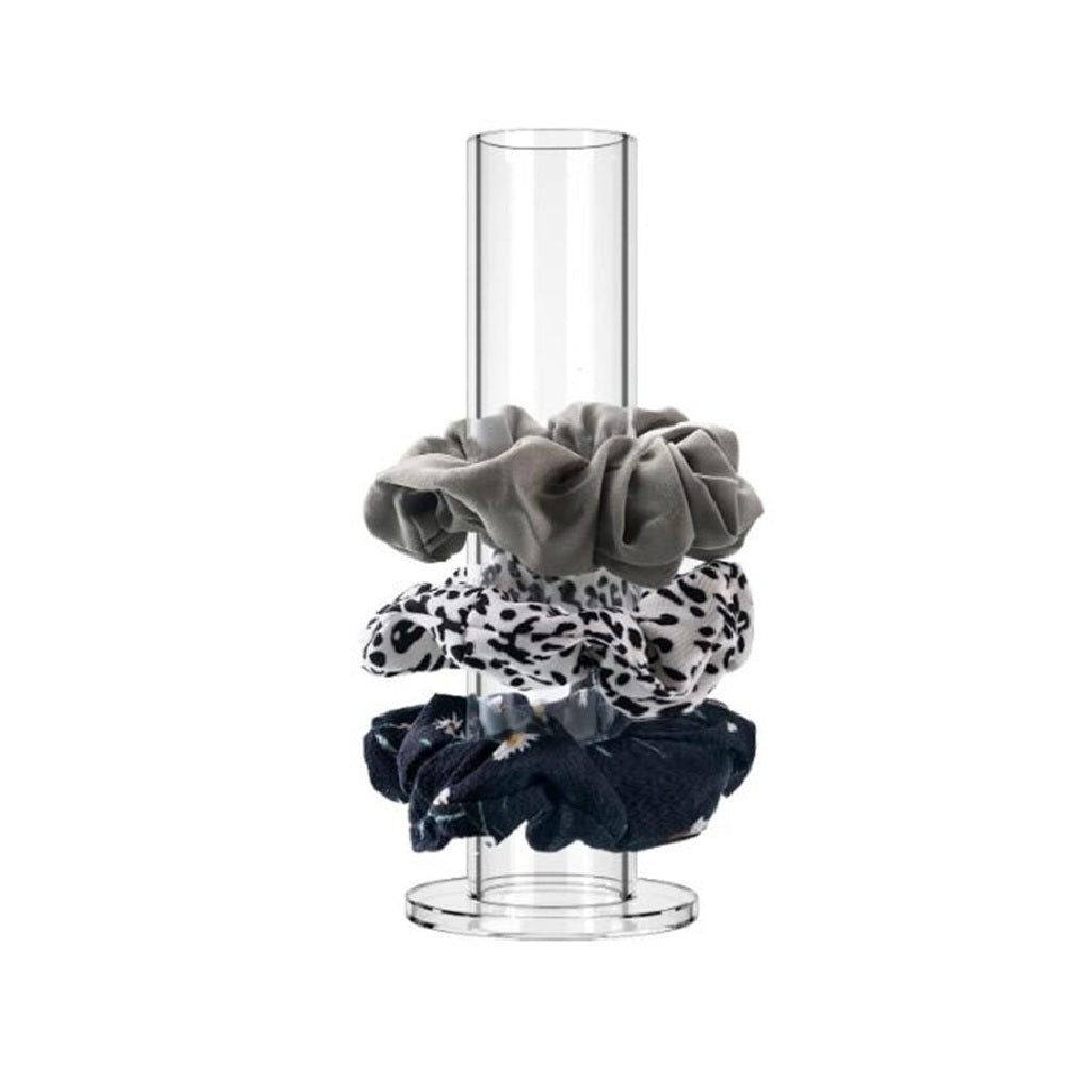 Set of three scrunchies on a clear stand