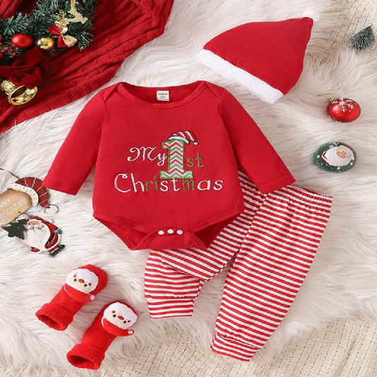 Red baby outfit with 'My 1st Christmas' text, hat, and socks on a fluffy white surface with Christmas decorations.