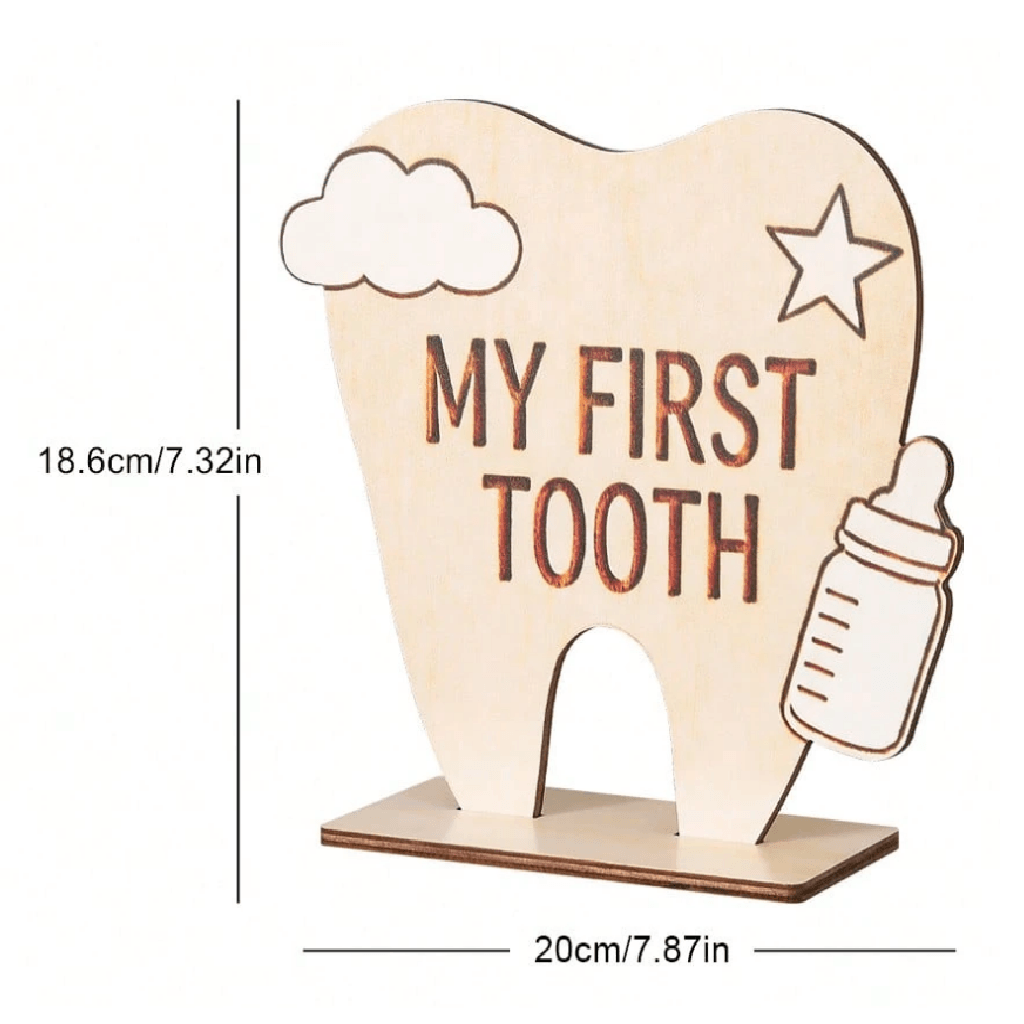 Wooden tooth-shaped holder with 'My First Tooth' text and measurements on a white background
