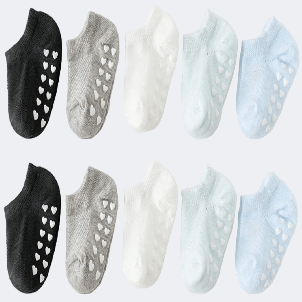 Set of six pairs of socks in black, gray, white, and light blue on a white background