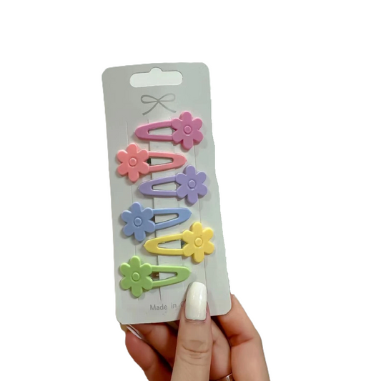 Set of colorful hair clips on a white background