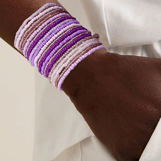 Multicolored beaded bracelets on a wrist