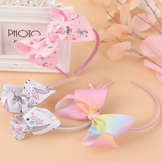 Three colorful headbands with bow designs