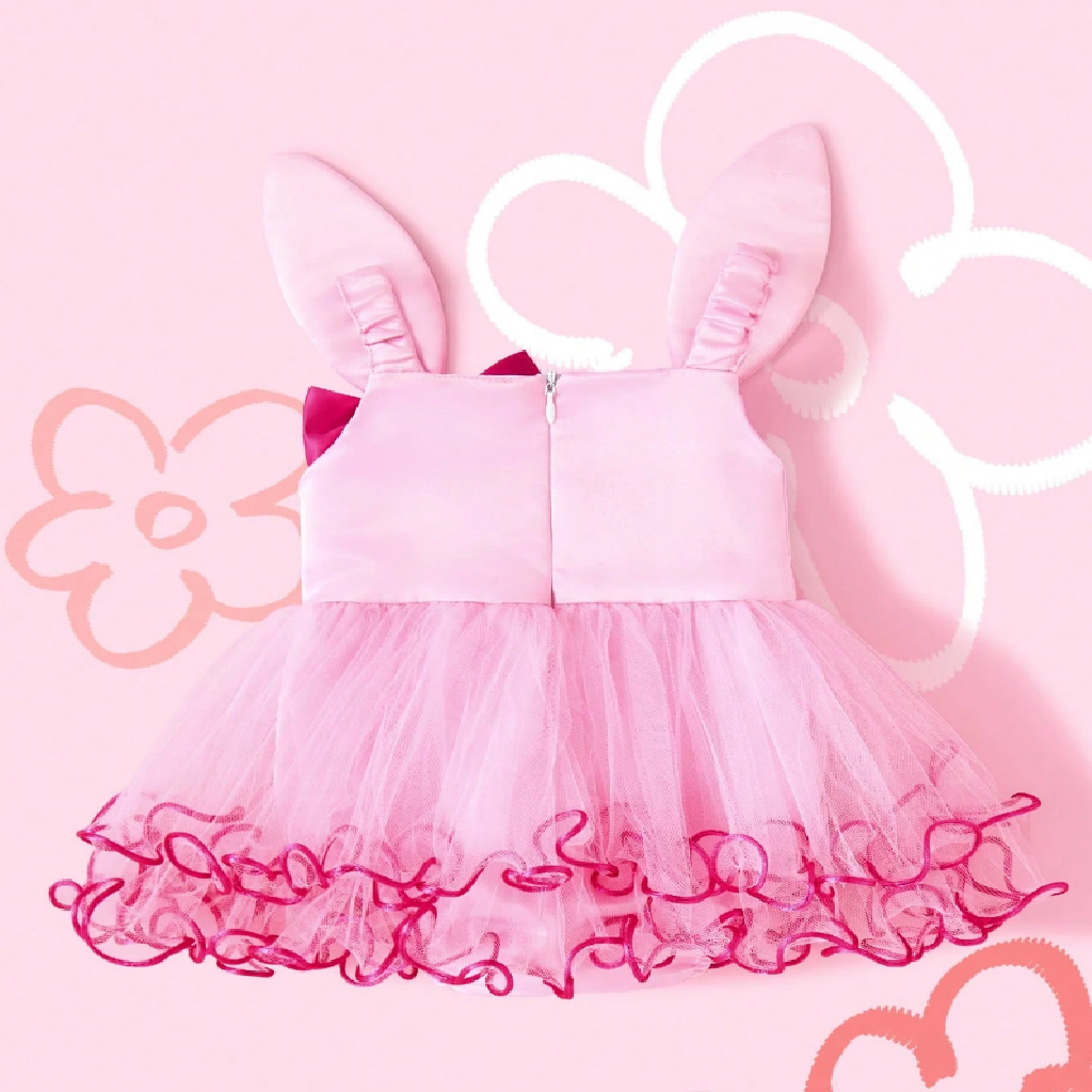 Pink dress with bow and ears on a pink background