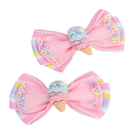 Two pink hair bows with ice cream character decorations