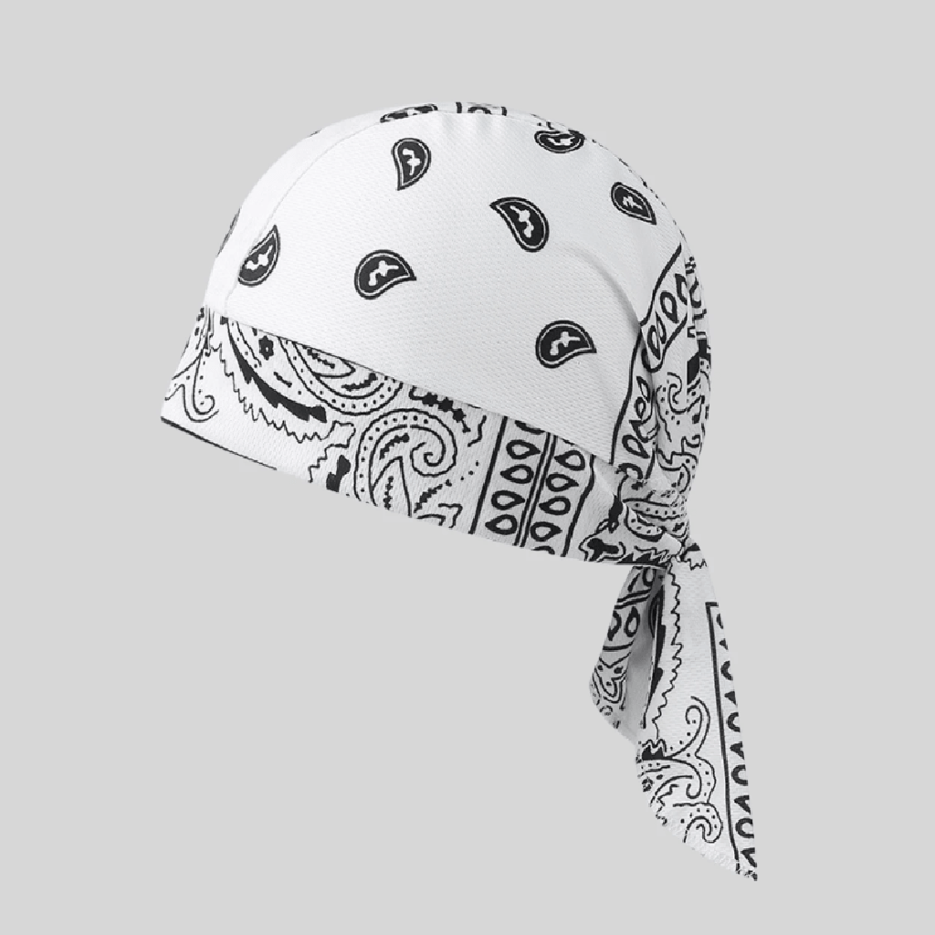 A white bandana-style head covering with black paisley and geometric patterns, tied at the back, shown on a plain light gray background.
