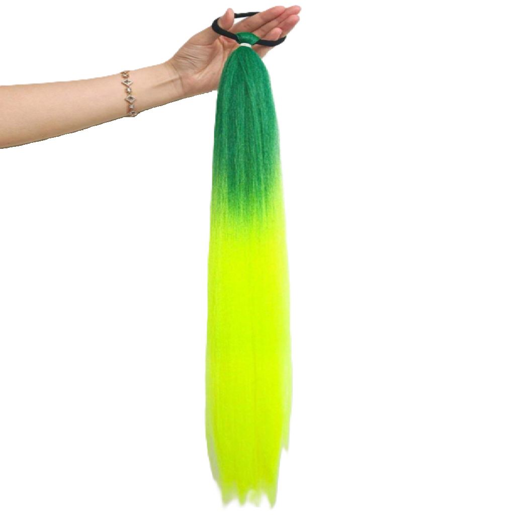 Green to yellow ombre hair extension held by a hand on a white background