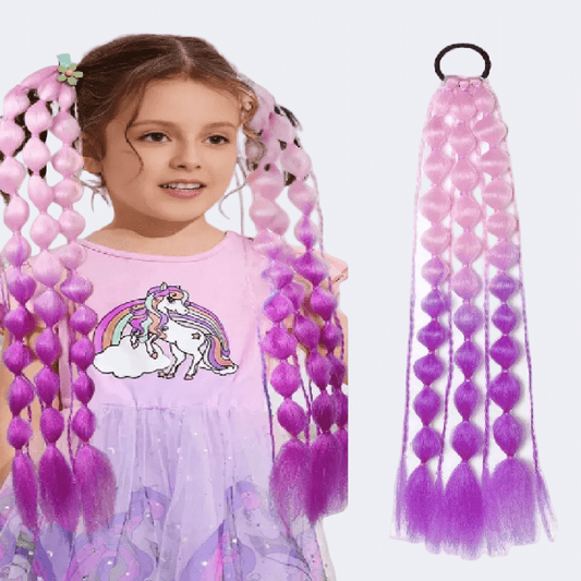 Young girl with pink and purple braided hair extensions on a white background
