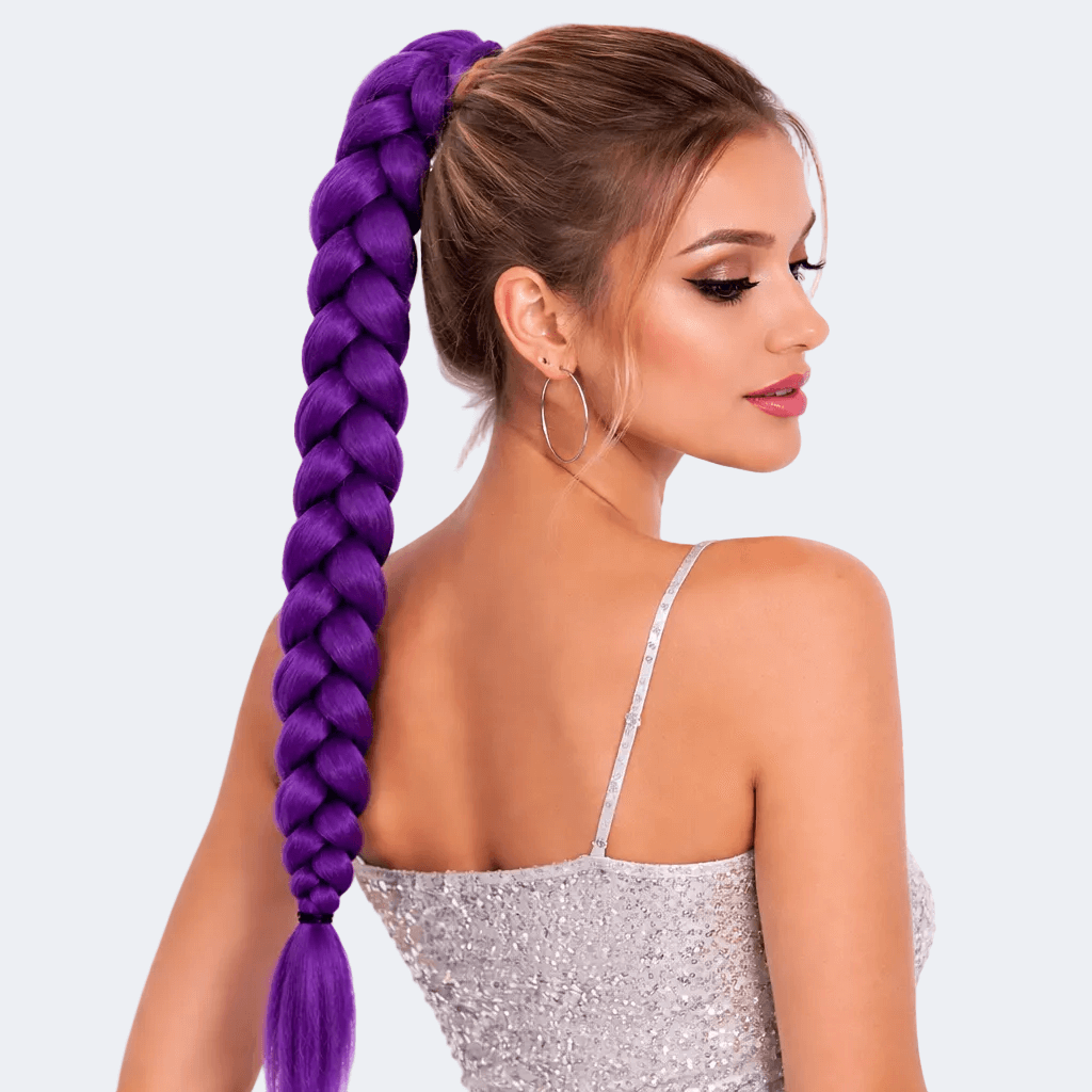 Woman with a purple braided ponytail wearing a silver dress on a light gray background
