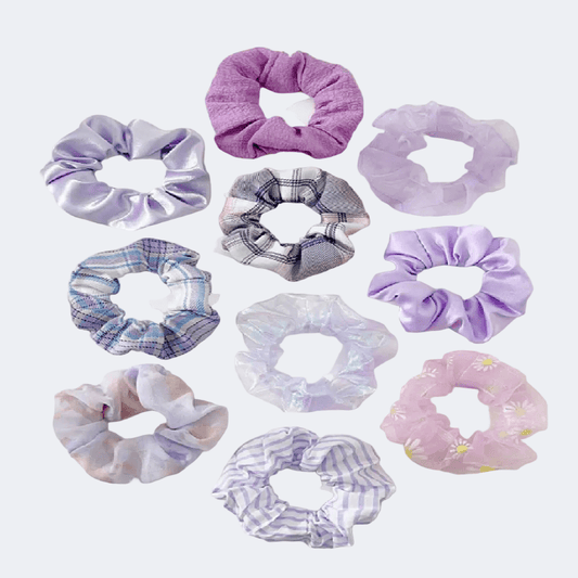 Collection of variously patterned scrunchies on a white background
