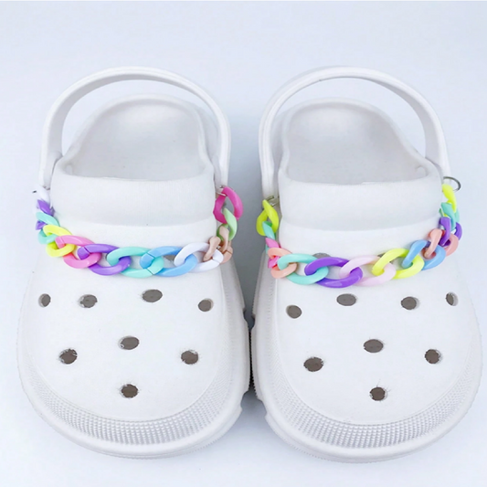 White clogs with colorful braided straps