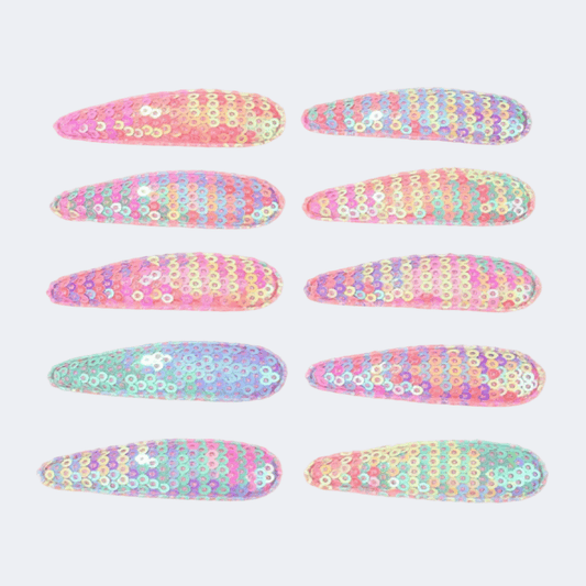 Set of colorful floral-patterned hair clips on a white background