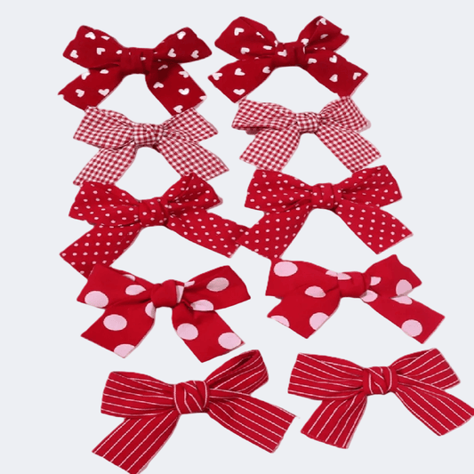 Collection of red bows with various patterns on a white background