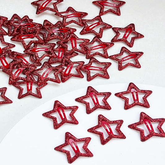 Red star-shaped hair clips