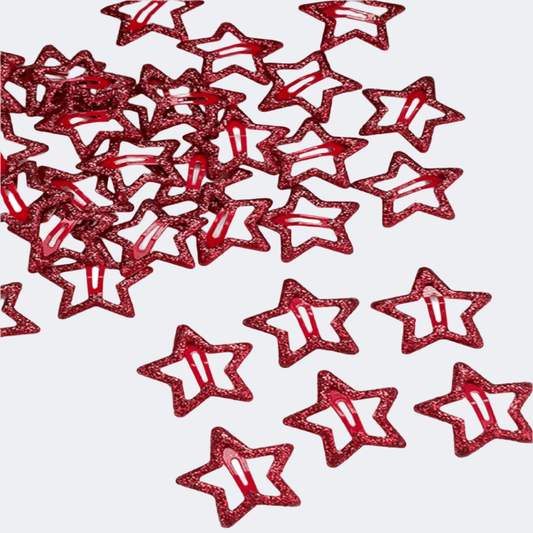Red glittery star-shaped confetti on a white background