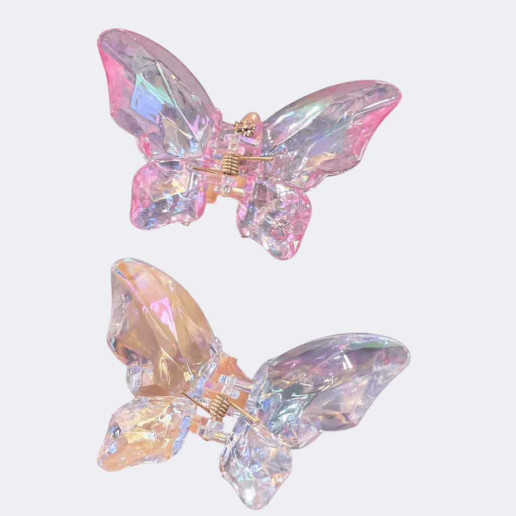 Butterfly-shaped earrings with iridescent wings on a light gray background