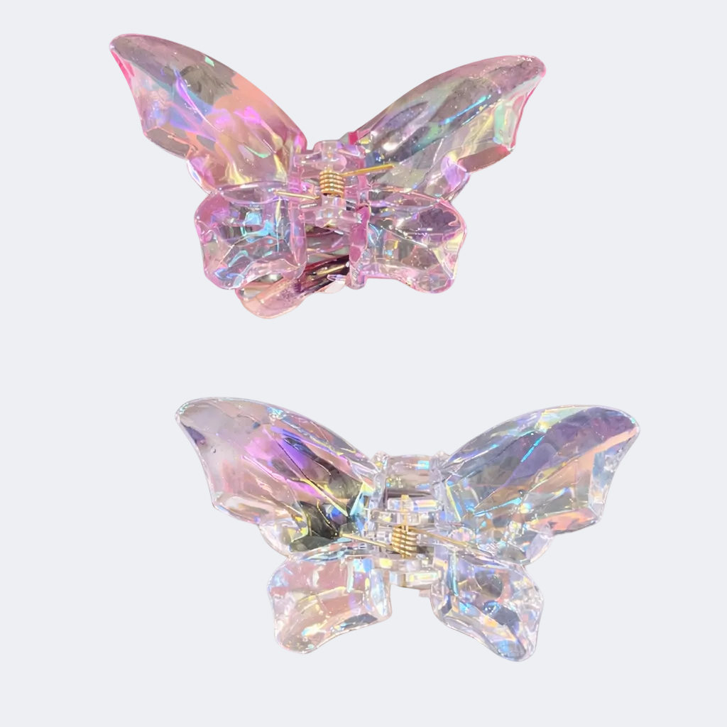 Two iridescent butterfly-shaped hair clips on a white background