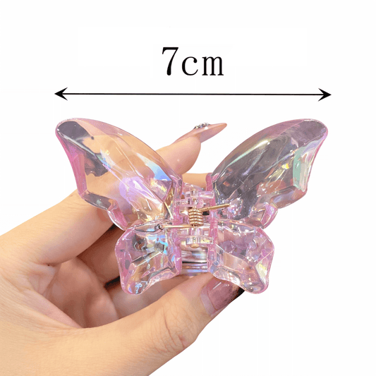 Butterfly-shaped hair clip held by a hand with measurement label '7cm'.