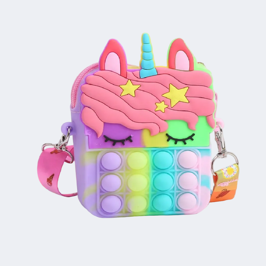 Colorful unicorn-themed pop-it fidget toy with a keychain on a white surface.