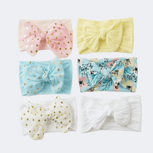 Set of six colorful headbands with various patterns on a white background