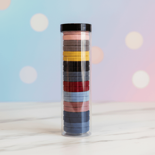 Tube of colorful washi tape on a light background
