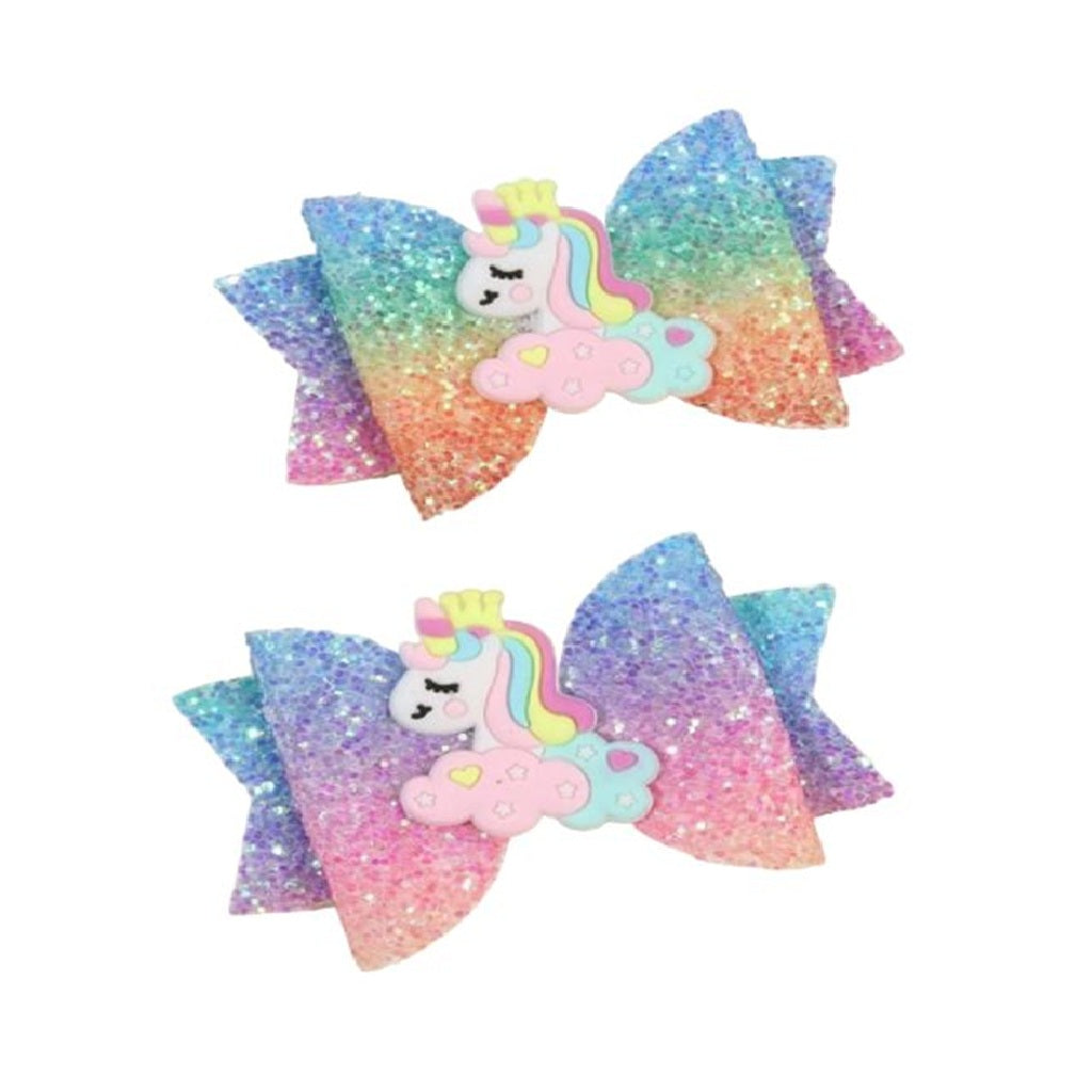 Two colorful glittery hair bows with unicorn designs 