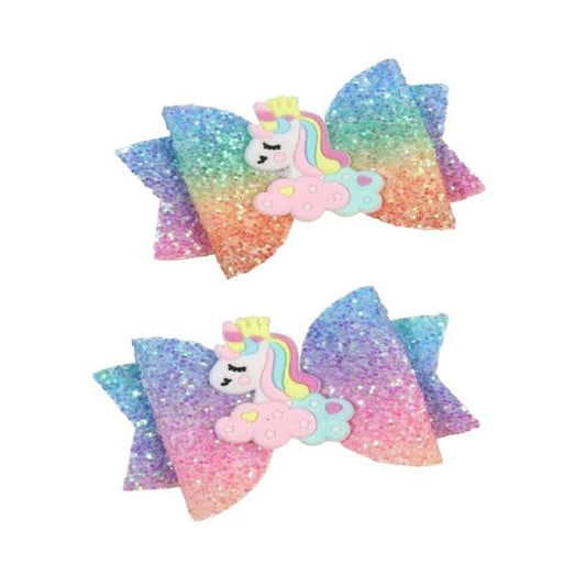 Two colorful glittery hair bows with unicorn designs 