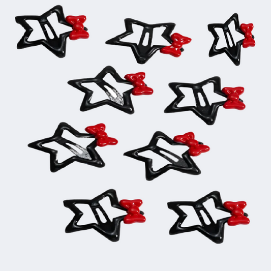 Star-shaped hair clips with red centers on a white background